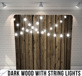 Dark wooden backdrop and string lights photo booth